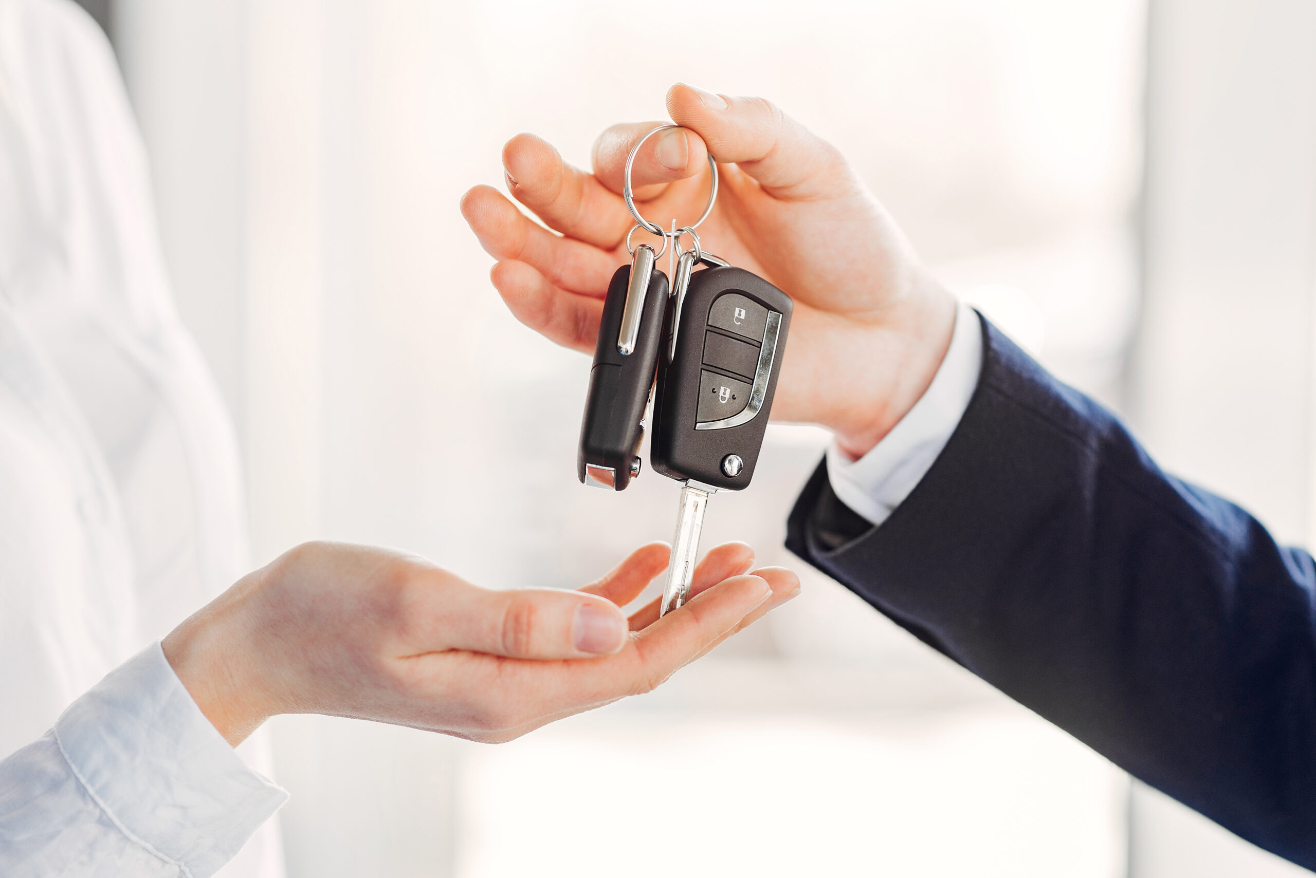 Stylish and elegant woman in a car salon Woman buying the car. Lady in a car salon. Manager with a client